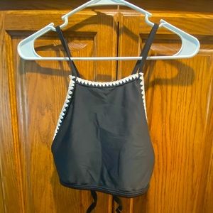 Women’s black bikini top with white trim